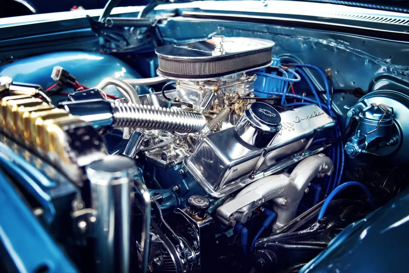 An engine with the covers off under shop lights