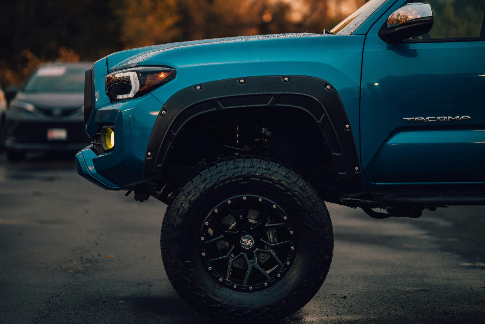 A work truck parked outside the shop