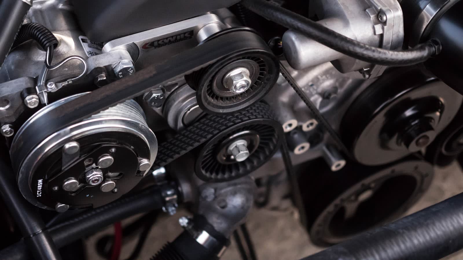 The belt that drives the air conditioning compressor
